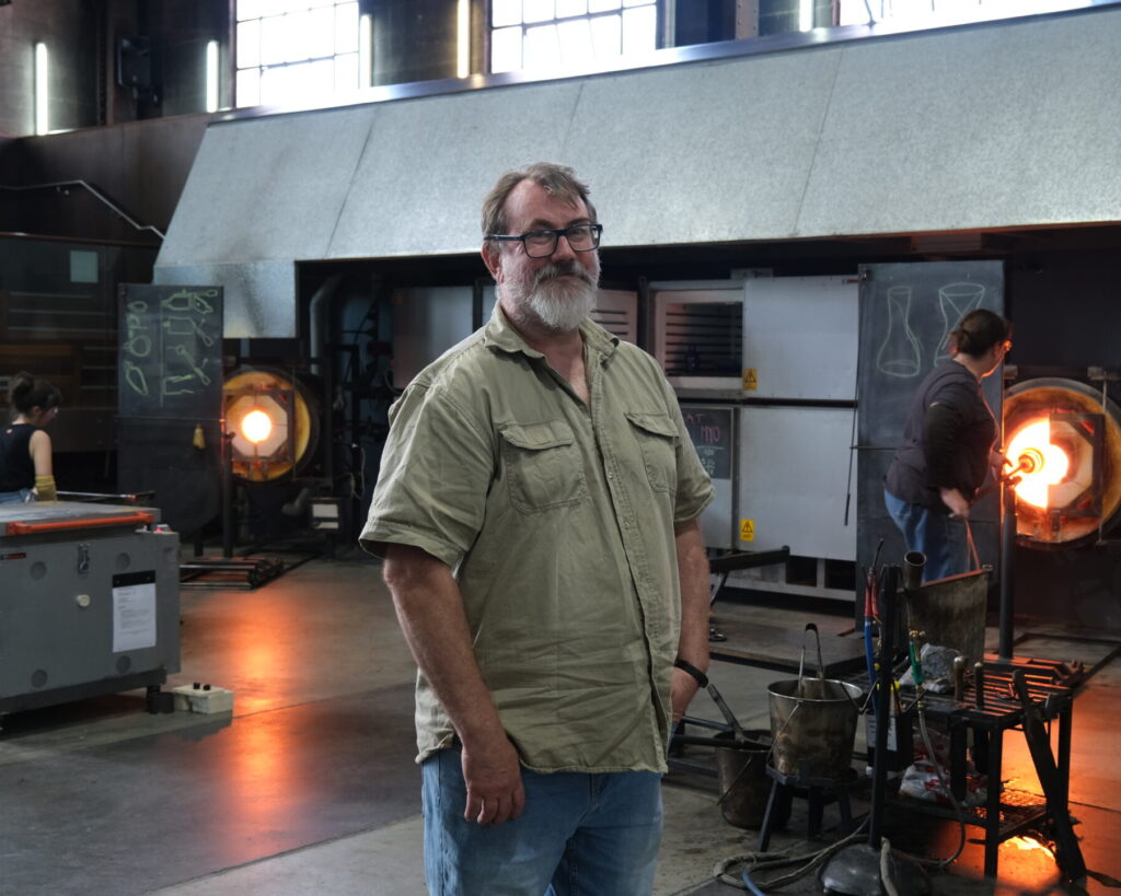 Tom Rowney in the Hotshop at Canberra Glassworks. Photo courtesy of Canberra Glassworks