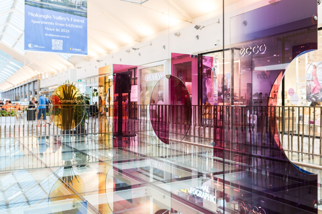 Colourful sheet glass installation in the centre of Canberra Centre mall