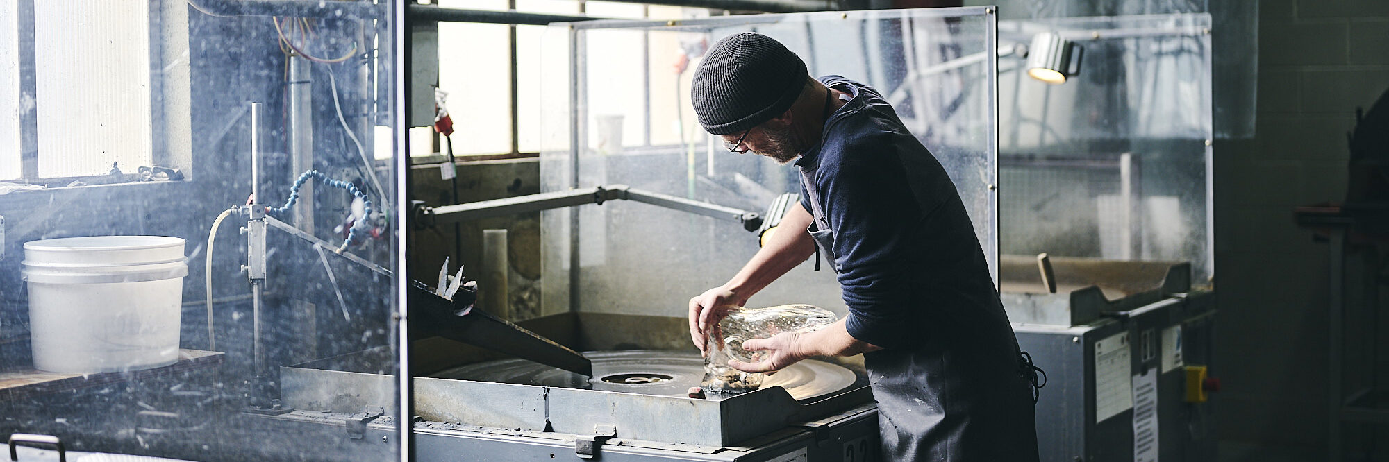 Bryan May working at the Canberra Glassworks. Photo by Pew Pew Studio for ArtsACT